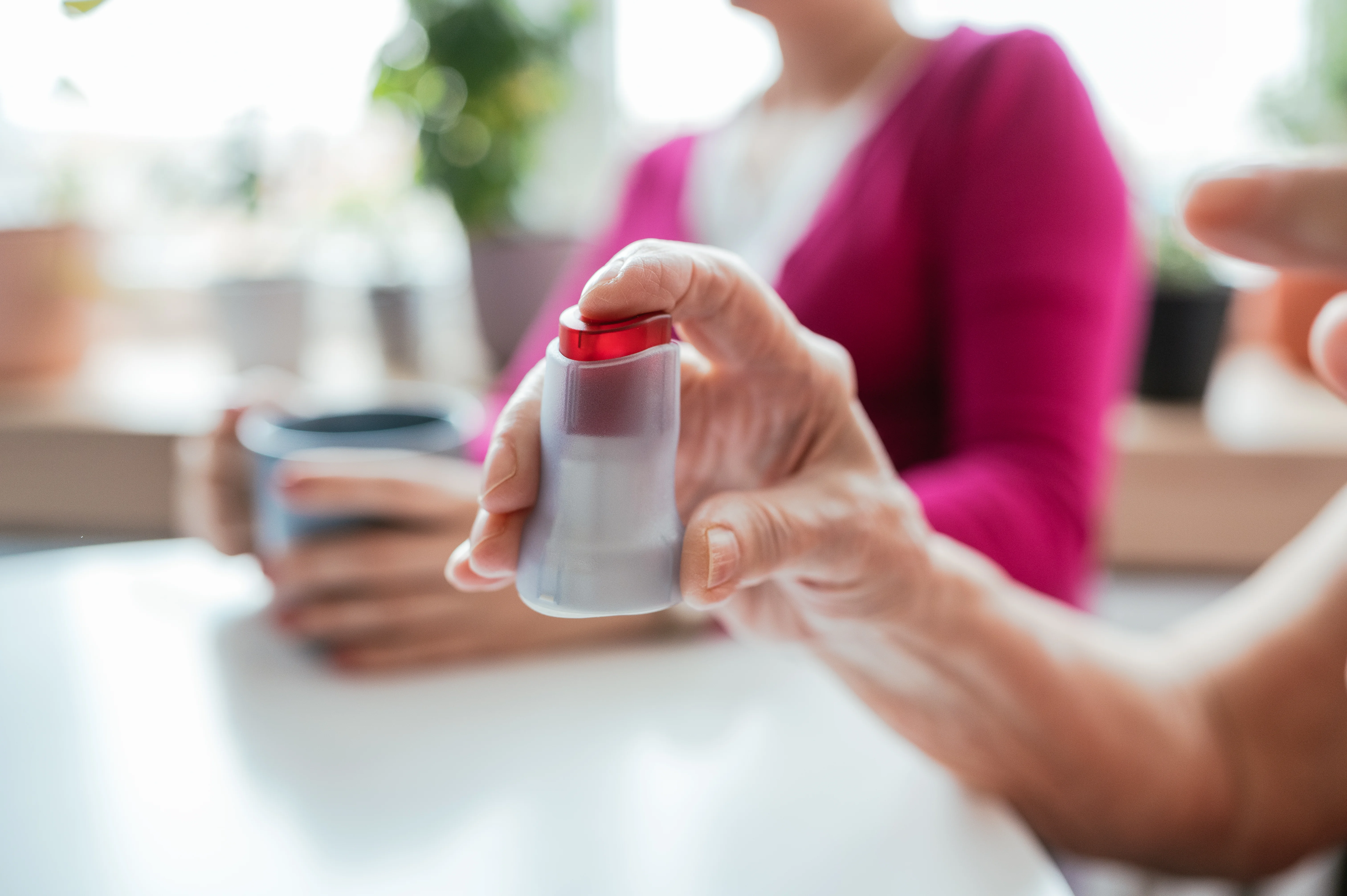 a person holding a bottle