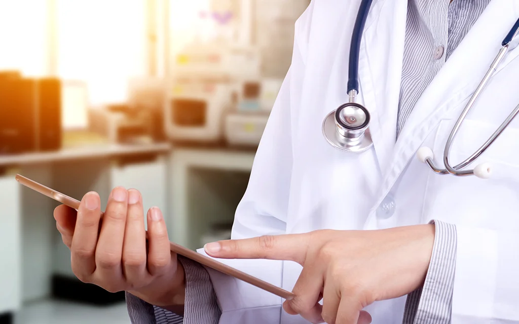 a doctor holding a patient's hand
