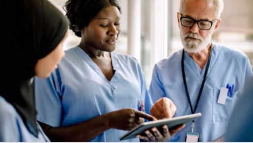 a doctor showing a patient something on the tablet